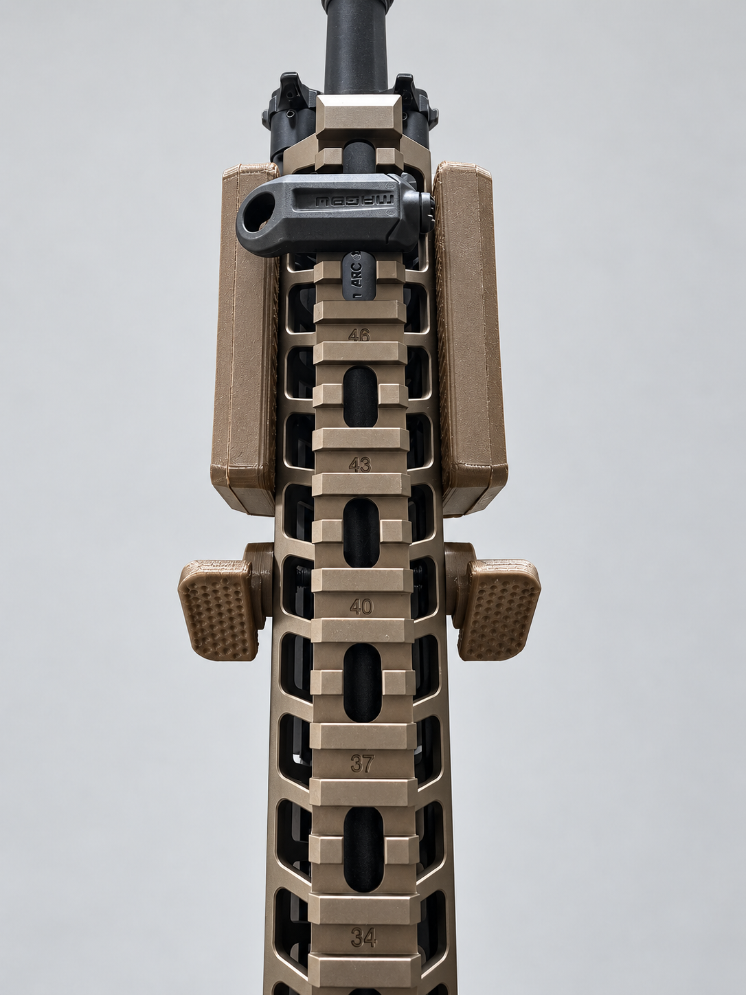 Ambidextrous FDE thumb rests mounted on both sides top-down view